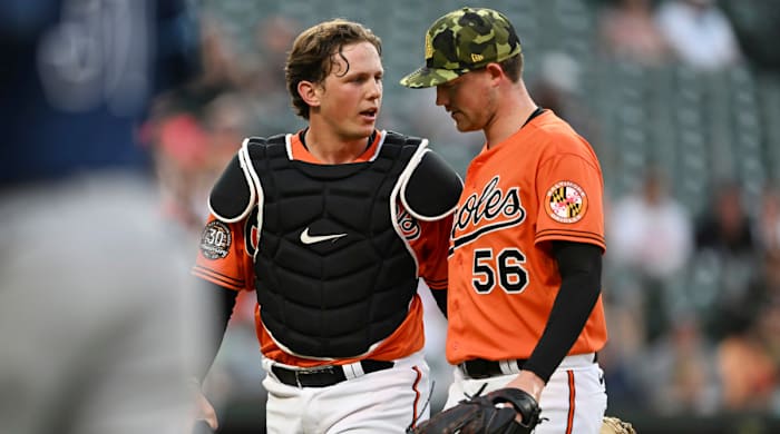 Adley Rutschman speaks with Orioles pitcher Kyle Bradish.